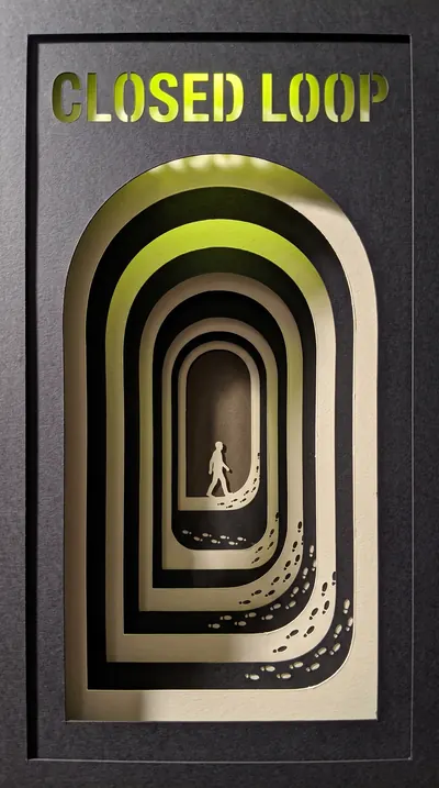 Cut-paper shadow-box theatre: seven layered planes of charco…